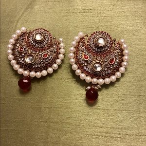 Earrings dressy and statement piece.